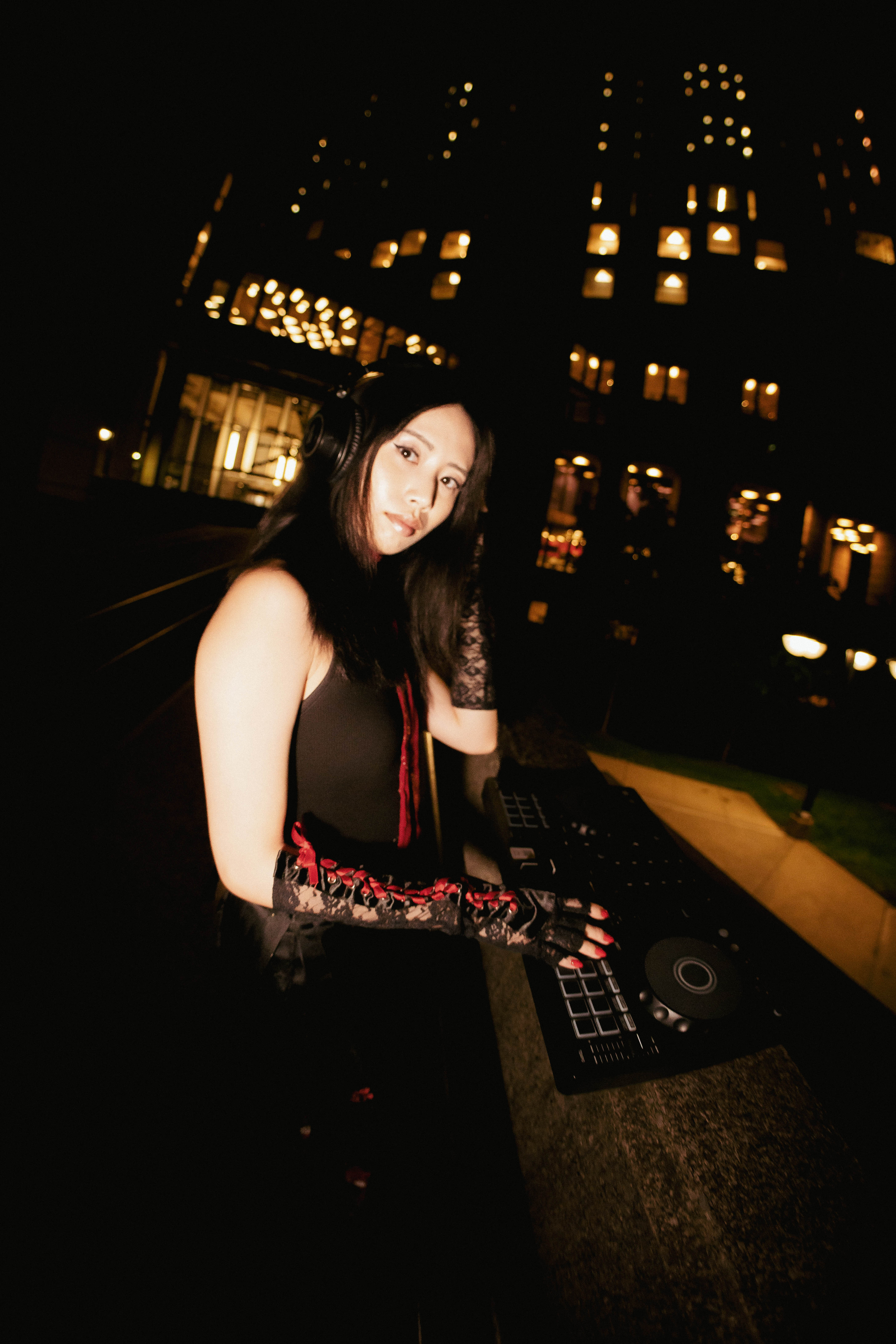WENG performing as a DJ at night